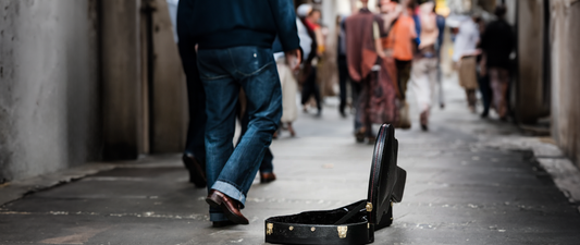 Guitar Case walking by - Lesson Pros|Ukulele With Case - Lesson Pros|Banjo Case Lesson Pros|||pile of money - Lesson Pros|Pile of Money - Lesson Pros